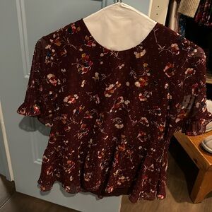 Madewell floral maroon top with ruffle sleeves and flowy bottom